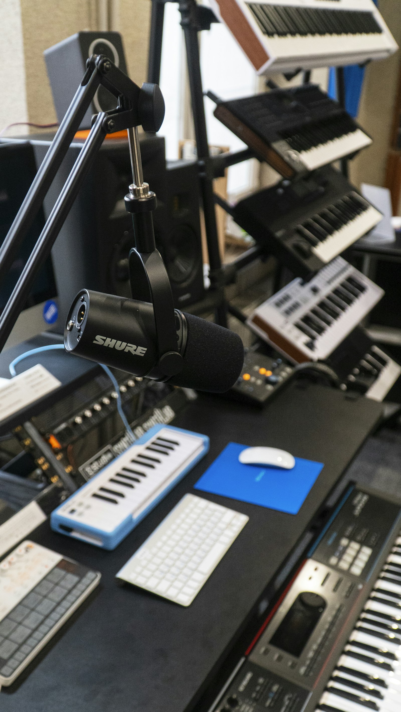 A professional recording studio with a microphone and keyboard